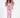 Model in Remi Salmon three-piece lounge set with oversized zip hoodie, cutout bodysuit, and high-waisted joggers.