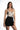 Model in Harmoni seamless carbon tie-dye bodysuit and high-waisted black denim shorts, chic aesthetic OOTD.