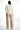 Back view of the Eden white tailored blazer for women, styled with beige wide-leg trousers on a white studio background.