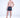 Man modeling Jaxon floral patterned swim trunks in black with red slides, showcasing trendy men's summer swimwear style.
