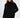 Model wearing a Celine black oversized knit turtleneck sweater with a unique distressed fringe hem against a white backdrop.