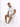 A man sits on a white cube, wearing a plain white t-shirt, gray shorts, and white sneakers, looking thoughtfully down.