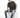 A man sits on a white cube, wearing a dark gray t-shirt with the word "challenge" and blue jeans, paired with black s...
