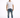 A man stands confidently in a fitted white t-shirt, distressed blue jeans, and white sneakers.