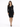 A woman in a fitted black dress with long sleeves and a decorative neckline stands confidently in front of a white ba...