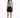 A model poses in a fitted long-sleeve top featuring graphic designs, paired with a black zippered skirt and heels.