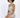 A model poses in a shimmering silver mini dress with cut-out details and a halter neckline.