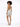 A model showcases a shimmering silver mini dress with a halter neck and open back, paired with stylish heels.