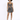 A model poses in a shimmering, fitted dress with a crisscross design and spaghetti straps, showcasing a stylish look.
