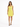 A woman stands in a bright yellow sleeveless dress, paired with black strappy heels, against a white background.