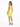 A woman in a bright yellow dress with cut-out details, paired with black high-heeled sandals, poses from the back.