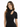 A woman with long, wavy hair wears a fitted black top featuring a mock neck and a stylish cutout.