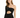A model poses in a black, one-shoulder dress with a cutout and draped fabric, featuring subtle sparkles.