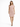 A woman stands confidently in a light pink, short-sleeved dress paired with black strappy heels.