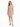 A woman stands confidently in a soft pink sleeveless dress, paired with black strappy heels.