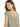 A woman with long hair smiles over her shoulder, wearing a green top with a deep V-back design.