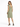 A woman stands in a green dress with a deep V-back, paired with black high-heeled sandals.
