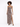 A model poses in a leopard print maxi dress with a thigh-high slit and spaghetti straps, showcasing a stylish look.