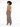 A model showcases a form-fitting leopard print dress with a low back and high slit, paired with black heels.