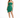 A model poses in a strapless green dress with cut-out details and a wrap-style hem, paired with black heels.