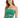 A model wearing a strapless, sparkly green top with crisscross detailing and a fitted silhouette.