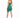 A woman in a fitted, strapless green dress with a high-low hemline, paired with black high heels.