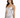 A model poses in a silver, form-fitting dress with thin straps and gathered detailing.