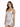 A model poses in a silver, form-fitting dress with thin straps and gathered detailing.