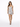 A model poses in a sleek, silver, form-fitting dress with thin straps and a ruched design.