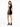 A woman in a fitted black dress with a high neckline and lace-up side detail, paired with black heels.