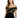 A woman models a fitted black dress with off-the-shoulder sleeves and intricate gold detailing.