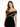 A woman models a fitted black dress with off-the-shoulder sleeves and intricate gold detailing.