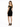 A woman stands in a fitted black dress with off-the-shoulder sleeves and gold detailing, paired with black heels.