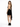 A woman in a black dress with a backless design and a flowing tie, paired with stylish black heeled boots.