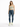 A woman stands confidently in a light green crop top, distressed blue jeans, and white sneakers with neon accents.