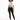 A model stands confidently in a graphic tee and black skinny jeans, paired with stylish black sneakers.
