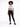 A model stands confidently in a graphic tee and black skinny jeans, paired with stylish black sneakers.