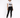 A model poses in a white graphic t-shirt and black skinny jeans, paired with black sneakers.