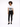 A model stands in a white graphic tee and black skinny jeans, paired with black sneakers on a plain background.