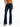 A person wearing a tied orange top and dark flared jeans, standing in black heeled sandals against a white background.