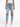 A person wearing distressed light blue jeans with large knee rips, paired with white sneakers and a fitted top.