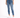 A person wearing a white cropped top and blue high-waisted skinny jeans, paired with white sneakers.