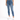 A person wearing a white cropped top and blue high-waisted skinny jeans, paired with white sneakers.