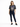 A woman stands confidently in a cropped graphic tee featuring a Florida design, paired with dark skinny jeans and bla...