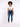 A model wearing a white cropped top and blue skinny jeans, paired with white sneakers, standing against a light backg...