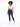 A model with curly hair wears a white cropped top and dark blue skinny jeans, paired with white sneakers.