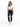 A woman stands confidently in a cropped white top and dark skinny jeans with distressed details, paired with white sn...