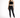 A model poses in a black lace crop top and fitted black jeans, paired with strappy black heels.