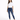 A woman stands confidently in a casual white t-shirt and fitted blue jeans with distressed details.