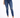 A person wearing fitted blue jeans with distressed knee details and white sneakers, standing against a plain background.